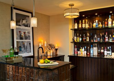 Custom black and brown patterned wet bar cabinets