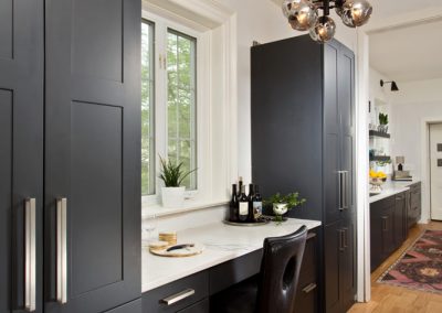 Sleek black built-in cabinetry and desk
