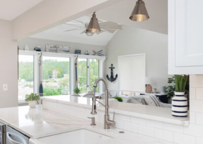 White custom kitchen cabinetry with silver hardware