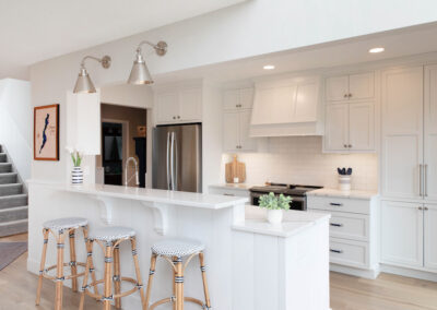 White custom kitchen cabinetry with silver hardware