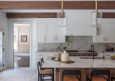 Sleek custom white kitchen cabinets with gold hardware
