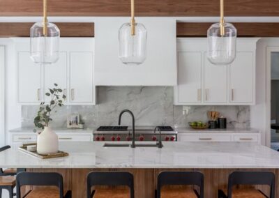 Sleek custom white kitchen cabinets with gold hardware