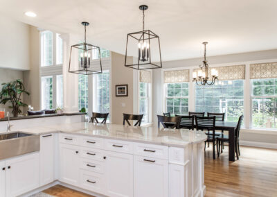 White custom kitchen cabinetry with black hardware